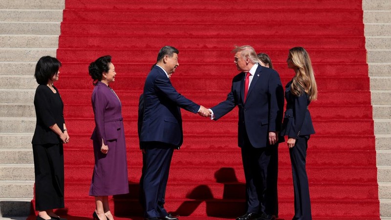 US President Donald Trump and Chinese President Xi Jinping shake hands alongside US first lady Melania Trump and Chinese President Xi Jinping's wife Peng Liyuan, after visiting the National Archives Museum in Washington, D.C., US, September 25, 2026.