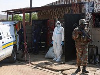 Emergency personnel work at the site of a deadly shooting at a tavern in Wedela township, southwest of Johannesburg, South Africa, September 27, 2026. REUTERS/Oupa Nkosi