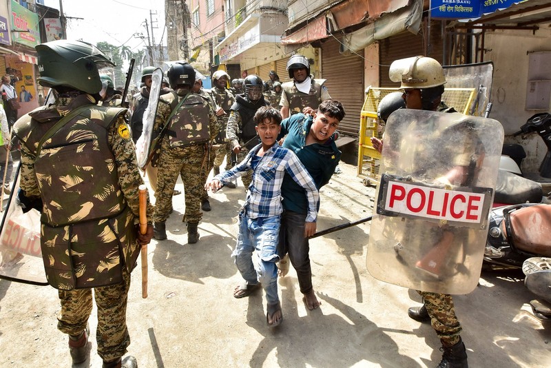 Protesters gesture towards police officers during a demonstration over the Shahi Masjid dispute in Ujjain, Madhya Pradesh, India, September 28, 2026. REUTERS/Stringer