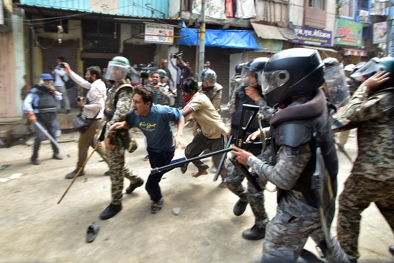 Protesters gesture towards police officers during a demonstration over the Shahi Masjid dispute in Ujjain, Madhya Pradesh, India, September 28, 2026. REUTERS/Stringer