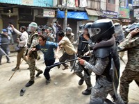 Police officers wield batons as they disperse protesters during a demonstration over the Shahi Masjid dispute in Ujjain, Madhya Pradesh, India, September 28, 2026. REUTERS/Stringer