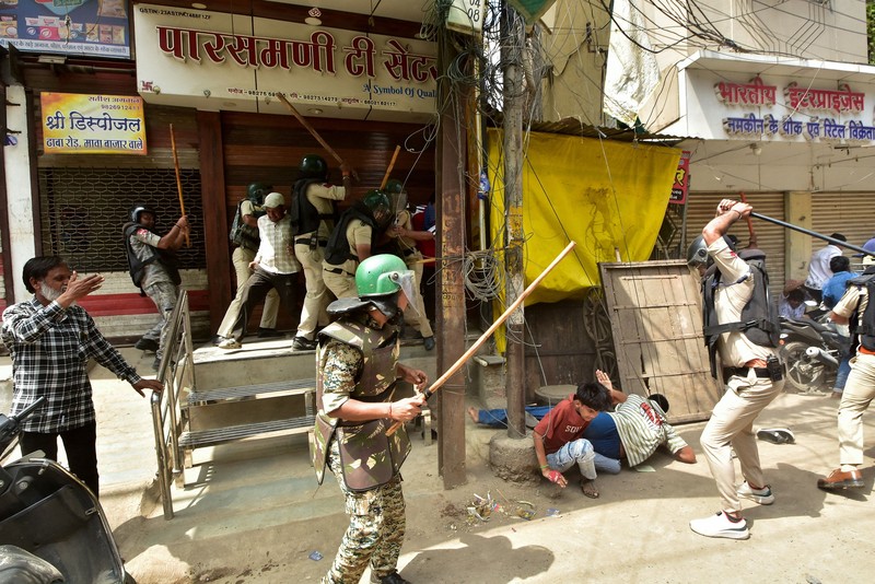Protesters gesture towards police officers during a demonstration over the Shahi Masjid dispute in Ujjain, Madhya Pradesh, India, September 28, 2026. REUTERS/Stringer