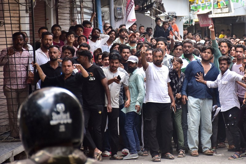 Protesters gesture towards police officers during a demonstration over the Shahi Masjid dispute in Ujjain, Madhya Pradesh, India, September 28, 2026. REUTERS/Stringer