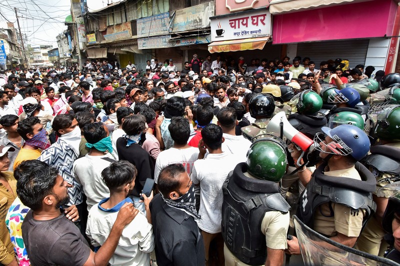 Protesters gesture towards police officers during a demonstration over the Shahi Masjid dispute in Ujjain, Madhya Pradesh, India, September 28, 2026. REUTERS/Stringer