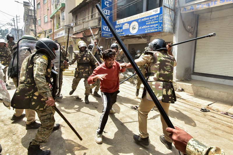 Protesters gesture towards police officers during a demonstration over the Shahi Masjid dispute in Ujjain, Madhya Pradesh, India, September 28, 2026. REUTERS/Stringer