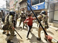 Police officers wield batons as they disperse protesters during a demonstration over the Shahi Masjid dispute in Ujjain, Madhya Pradesh, India, September 28, 2026. REUTERS/Stringer     TPX IMAGES OF THE DAY