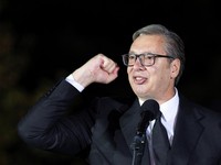 Serbian President Aleksandar Vucic gestures to citizens outside the Presidency of Serbia moments before formally submitting his resignation, ending his second and final five-year term in office, in Belgrade, Serbia, September 27, 2026. REUTERS/Djordj