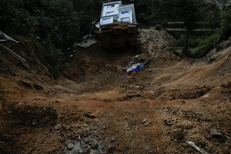 A toppled house after it was swept by a landslide, following incessant rains, in Lalitpur, Nepal, September 28, 2026. REUTERS/Navesh Chitrakar