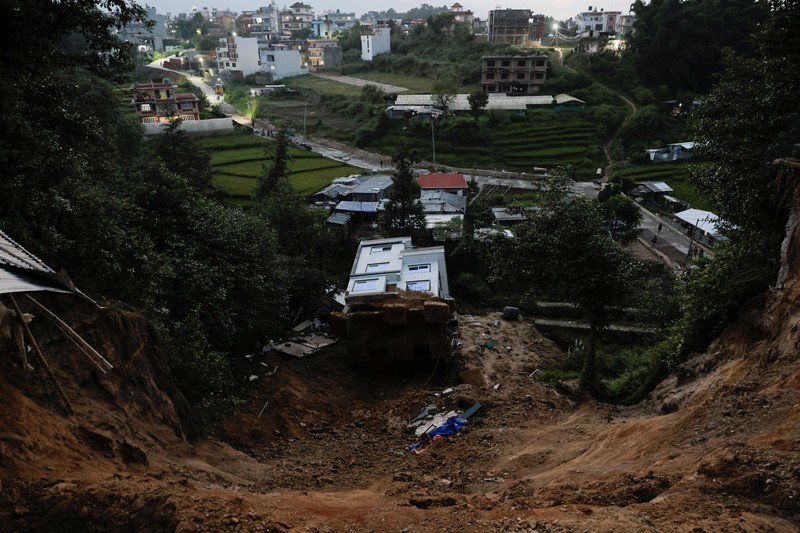 A toppled house after it was swept by a landslide, following incessant rains, in Lalitpur, Nepal, September 28, 2026. REUTERS/Navesh Chitrakar