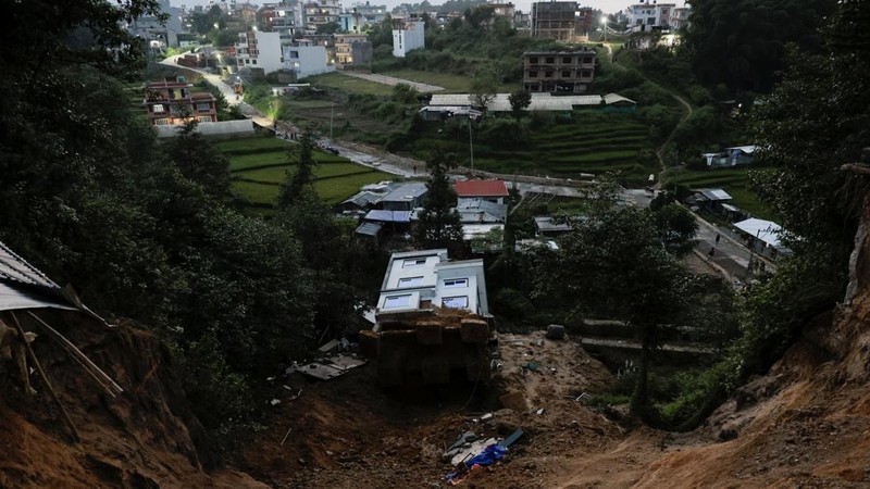A toppled house after it was swept by a landslide, following incessant rains, in Lalitpur, Nepal, September 28, 2026. REUTERS/Navesh Chitrakar