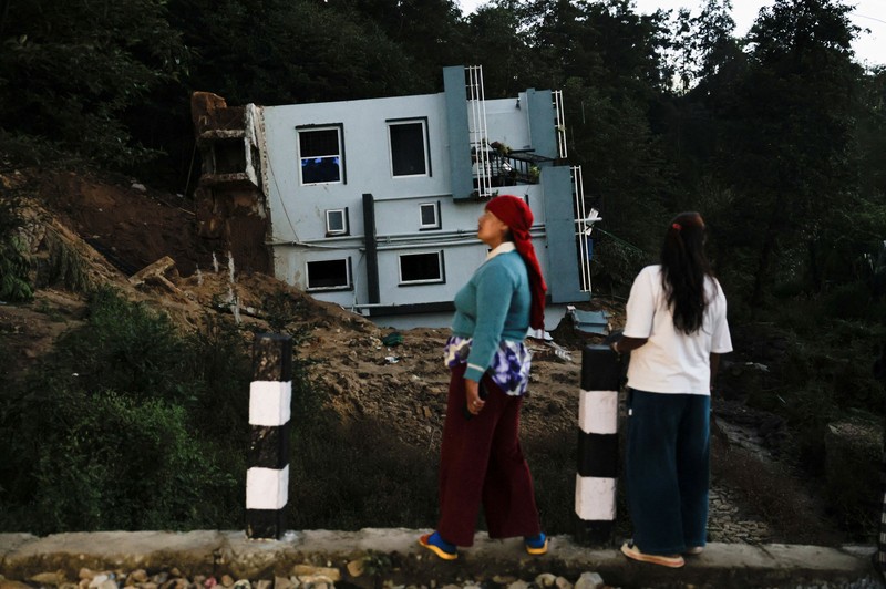 A toppled house after it was swept by a landslide, following incessant rains, in Lalitpur, Nepal, September 28, 2026. REUTERS/Navesh Chitrakar
