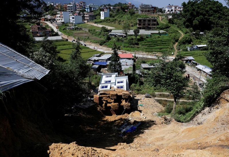 A toppled house after it was swept by a landslide, following incessant rains, in Lalitpur, Nepal, September 28, 2026. REUTERS/Navesh Chitrakar