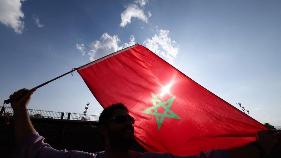 A Morocco's fan waves a flag ahead of the 2026 World Cup round of 32 football match between the Netherlands and Morocco at the Monterrey Stadium in Guadalupe on June 29, 2026.  (Photo by Julio Cesar AGUILAR / AFP)