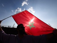 A Morocco's fan waves a flag ahead of the 2026 World Cup round of 32 football match between the Netherlands and Morocco at the Monterrey Stadium in Guadalupe on June 29, 2026.  (Photo by Julio Cesar AGUILAR / AFP)