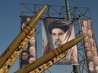 Iranian missiles are displayed next to a banner with a picture of Iran's Supreme Leader Mojtaba Khamenei, on a street in Tehran, Iran, September 27, 2026. Majid Asgaripour/WANA (West Asia News Agency) via REUTERS ATTENTION EDITORS - THIS PICTURE WAS
