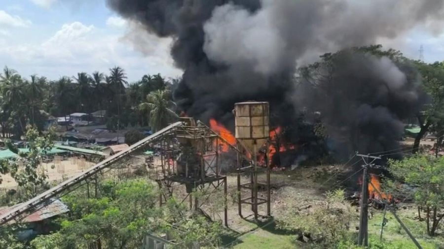 Smoke rises as fire burns following a Myanmar military airstrike, according to a rebel group that controls the area and a local aid worker, in Kyauktaw, Rakhine State, Myanmar, in this screen grab obtained from a social media video released September