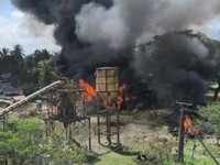 Smoke rises as fire burns following a Myanmar military airstrike, according to a rebel group that controls the area and a local aid worker, in Kyauktaw, Rakhine State, Myanmar, in this screen grab obtained from a social media video released September