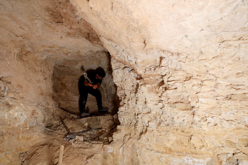 A Palestinian serves tea in a cave used as a house after Israeli forces demolished his house, in Masafer Yatta near Hebron in the Israeli-occupied West Bank, September 18, 2026. REUTERS/Mussa Qawasma