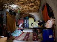 Palestinians live in a cave used as a house after Israeli forces demolished their house, in Masafer Yatta near Hebron in the Israeli-occupied West Bank, September 18, 2026. REUTERS/Mussa Qawasma     TPX IMAGES OF THE DAY