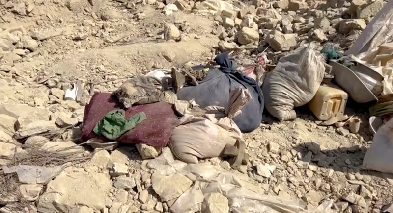 Men salvage their belongings from the debris of a house that was damaged in what the Taliban said was a Pakistani airstrike in Shultan district in Kunar province, Afghanistan, October 1, 2026. REUTERS/Stringer