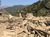 Men salvage their belongings from the debris of a house that was damaged in what the Taliban said was a Pakistani airstrike in Shultan district in Kunar province, Afghanistan, October 1, 2026. REUTERS/Stringer