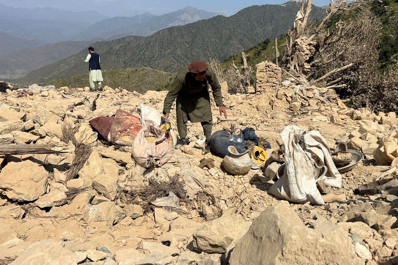 Men salvage their belongings from the debris of a house that was damaged in what the Taliban said was a Pakistani airstrike in Shultan district in Kunar province, Afghanistan, October 1, 2026. REUTERS/Stringer