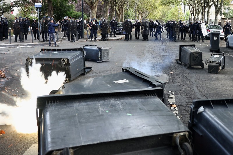 French CRS riot police stand in position in a street amid clashes during a protest by French high school and university students near Lycee Paul Eluard high-school to demand the hiring of substitute teachers, increased resources and better learning conditions, and to support the ongoing high-school student movement in the Seine-Saint-Denis department, in Saint-Denis near Paris, France, October 1, 2026.  REUTERS/Abdul Saboor