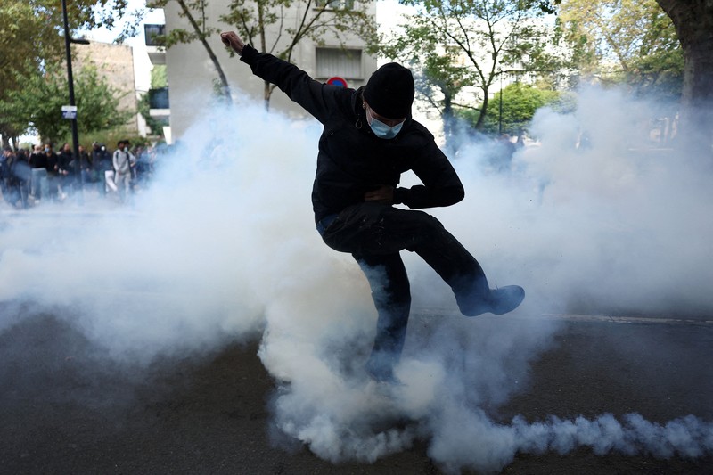 French CRS riot police stand in position in a street amid clashes during a protest by French high school and university students near Lycee Paul Eluard high-school to demand the hiring of substitute teachers, increased resources and better learning conditions, and to support the ongoing high-school student movement in the Seine-Saint-Denis department, in Saint-Denis near Paris, France, October 1, 2026.  REUTERS/Abdul Saboor