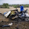 Officials work at the site of a helicopter crash at Kudenga Farm in the Marondera rural area, east of Harare, Zimbabwe, October 1, 2026. REUTERS/Philimon Bulawayo