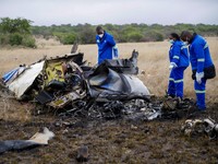 Officials work at the site of a helicopter crash at Kudenga Farm in the Marondera rural area, east of Harare, Zimbabwe, October 1, 2026. REUTERS/Philimon Bulawayo     TPX IMAGES OF THE DAY