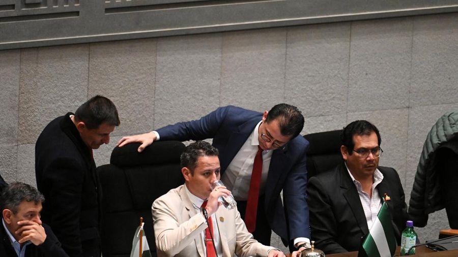 Bolivia's Vice President and President of the Plurinational Legislative Assembly Edmand Lara, drinks water while presiding over a session of the Plurinational Legislative Assembly, where the extension of the state of emergency for 90 days is being di