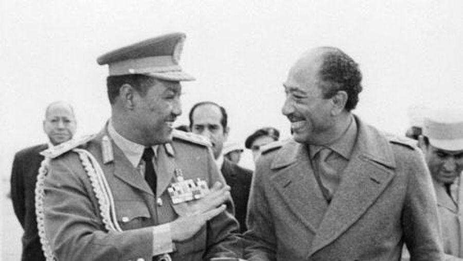 Sudan President Gaafar al-Nimeiry (L) smiles in February 1974 while he walks with Egyptian President Awar al-Sadat upon his arrival in Cairo for an official visit to Egypt. Nimeiry, who ruled Sudan from 1969 during 16 years, was ousted in April 1985