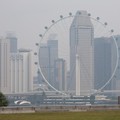 FILE PHOTO: The Singapore Flyer and commercial buildings are shrouded in haze at the Marina Bay area in Singapore, September 15, 2026. REUTERS/Ore Huiying/File Photo