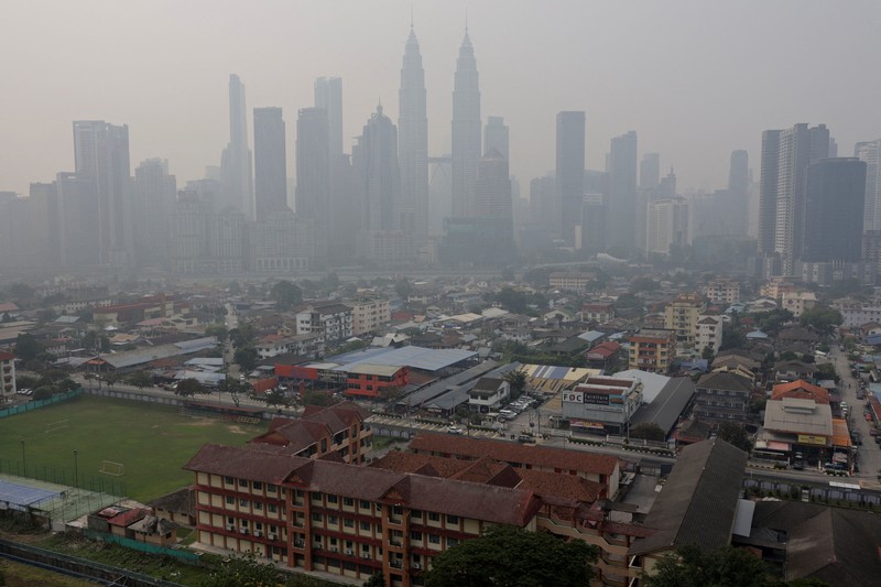 Kuala Lumpur's skyline shrouded in haze from regional wildfires, in Kuala Lumpur, Malaysia, October 9, 2026. REUTERS/Hasnoor Hussain