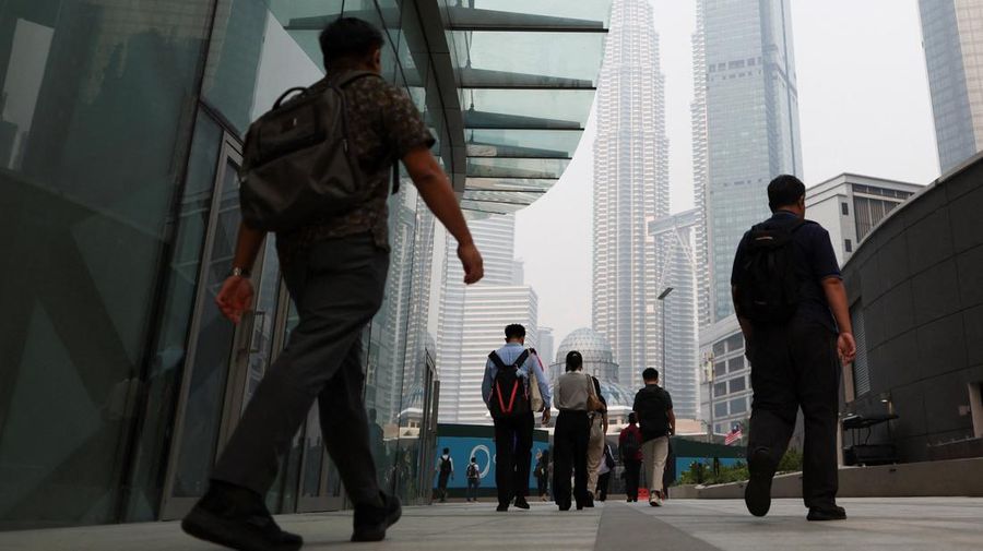 People come out of the MRT station during the morning rush in Kuala Lumpur, Malaysia, October 8, 2026. REUTERS/Hasnoor Hussain