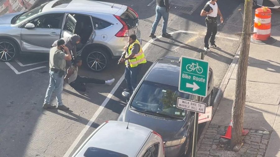 A man is detained after a shooting reportedly involving US Immigration and Customs Enforcement (ICE) officers in New York City, US, October 8, 2026.  in this screengrab obtained from a video. Stephanie/Handout via REUTERS    THIS IMAGE HAS BEEN SUPPL