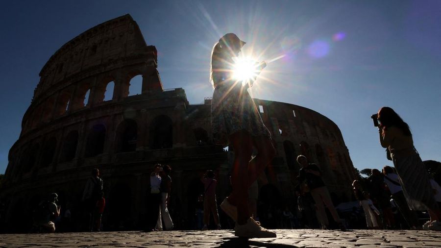 People walk outside the Colosseum as it is set to reopen today, after closing for a day as a mark of respect following the death of Andrea Moretti, a 22-year-old technician, in an overnight accident, in Rome, Italy, September 26, 2026. REUTERS/Yara N