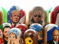Traditional Russian wooden nesting dolls, Matryoshka dolls, depicting Russian President Vladimir Putin (R) and US President Donald Trump (L) are displayed for sale in a shop at Izmailovo market in Moscow on February 10, 2026. (Photo by Hector RETAMAL