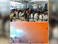 Foto kombinasi menunjukkan rekaman CCTV orang-orang yang mengantre tepat sebelum serangan terjadi (atas), dan orang-orang yang bereaksi di tengah asap pada saat serangan terjadi (bawah), di Bandara Internasional King Khalid di Riyadh, Arab Saudi, 10