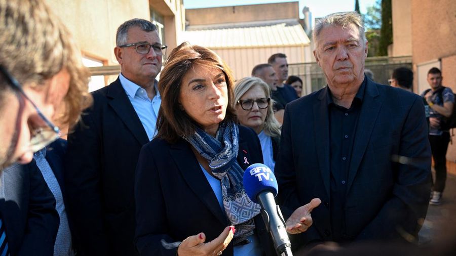 President of the Departmental Council of Bouches-du-Rhone Martine Vassal (C) addresses the media in front of Joseph-Lakanal middle school after a headmaster was injured by a hunting rifle shot and a teenager was arrested in Aubagne, southern France o