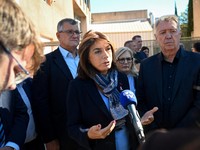 President of the Departmental Council of Bouches-du-Rhone Martine Vassal (C) addresses the media in front of Joseph-Lakanal middle school after a headmaster was injured by a hunting rifle shot and a teenager was arrested in Aubagne, southern France o