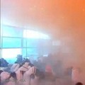 Rekaman pengawas memperlihatkan orang-orang bereaksi di tengah kepulan asap saat terjadi serangan di Bandara Internasional King Khalid di Riyadh, Arab Saudi, pada 10 Oktober 2026, dalam cuplikan dari video yang dirilis untuk umum ini. (Saudi Ministry
