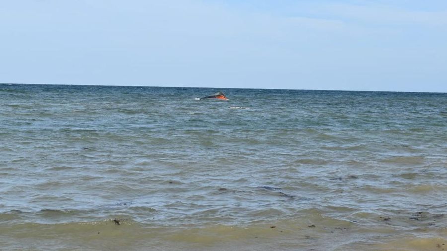 A portion of the vessel floats after it capsized while carrying about 305 people from Djibouti to Yemen, leaving at least 109 migrants, including 15 children, dead and more than 116 missing, according to the United Nations' International Organization