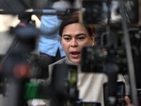 Philippine Vice President Sara Duterte talks to supporters as she prepares to leave the Quezon City Regional Trial Court after the postponement of her arraignment for the second time in Quezon City, Philippines, October 9, 2026. REUTERS/Noel Celis