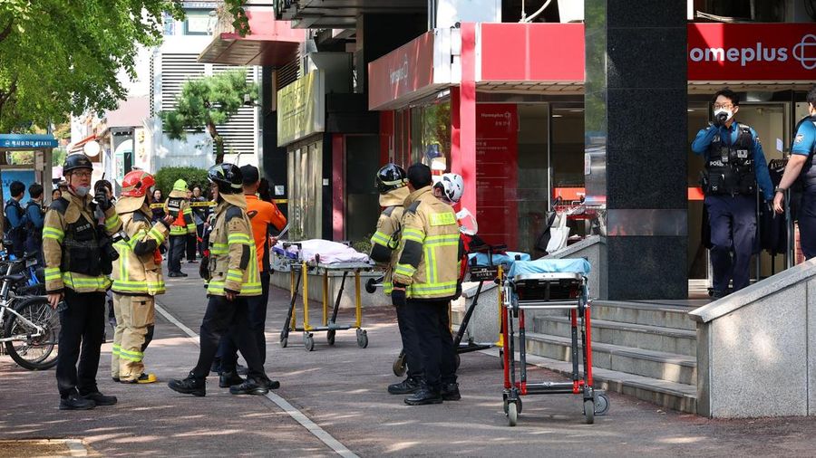 Firefighters and policemen gather outside the scene where several people were injured in a stabbing incident, in Incheon, South Korea, October 13, 2026.   Yonhap via REUTERS   THIS IMAGE HAS BEEN SUPPLIED BY A THIRD PARTY. NO RESALES. NO ARCHIVES. SO
