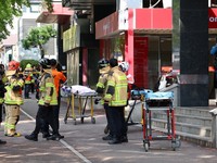 Firefighters and policemen gather outside the scene where several people were injured in a stabbing incident, in Incheon, South Korea, October 13, 2026.   Yonhap via REUTERS   THIS IMAGE HAS BEEN SUPPLIED BY A THIRD PARTY. NO RESALES. NO ARCHIVES. SO