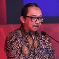 Wakil Menteri Keuangan RI Juda Agung, memberi sambutan dalam Prasasti Indonesia Policy Forum 2026, di The Ritz-Carlton Jakarta, Pacific Place, Jakarta, Selasa (13/10/2026). (CNBC Indonesia/Muhammad Sabki)