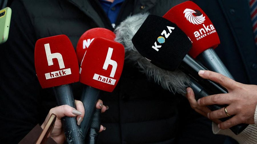 Halk TV microphones are pictured as presenter Serhan Asker, (not pictured), speaks to the media outside the broadcaster's Ankara bureau after Turkish authorities appointed a government trustee to run the pro-opposition broadcaster, in Ankara, Turkey,
