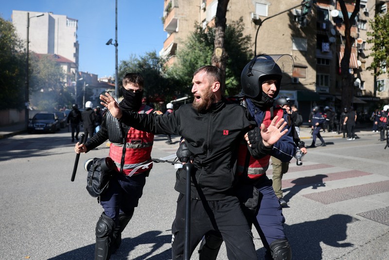 Protester wear masks, as Albanian students hold an anti-government protest in Tirana, Albania, October 19, 2026. REUTERS/Louisa Gouliamaki