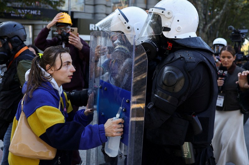 Protester wear masks, as Albanian students hold an anti-government protest in Tirana, Albania, October 19, 2026. REUTERS/Louisa Gouliamaki